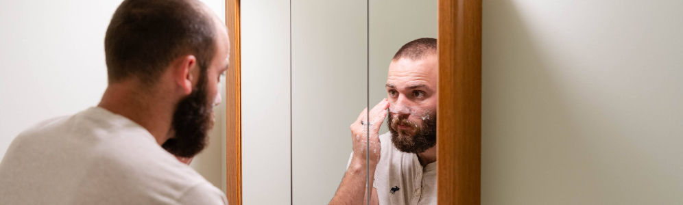 Colter washing his face with goat milk soap