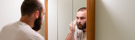 Colter washing his face with goat milk soap
