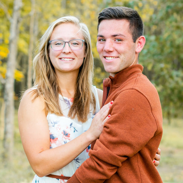 Couple embracing in a forest during autumn
