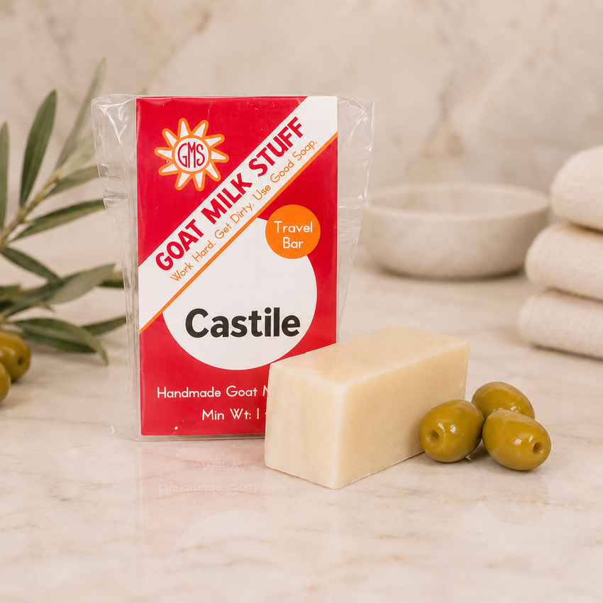 Goat Milk Stuff Castile soap bar with packaging on a neutral background
