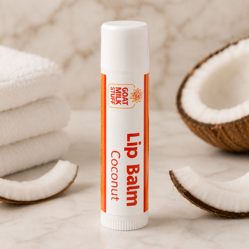 Lip balm stick with coconut pieces on a neutral background