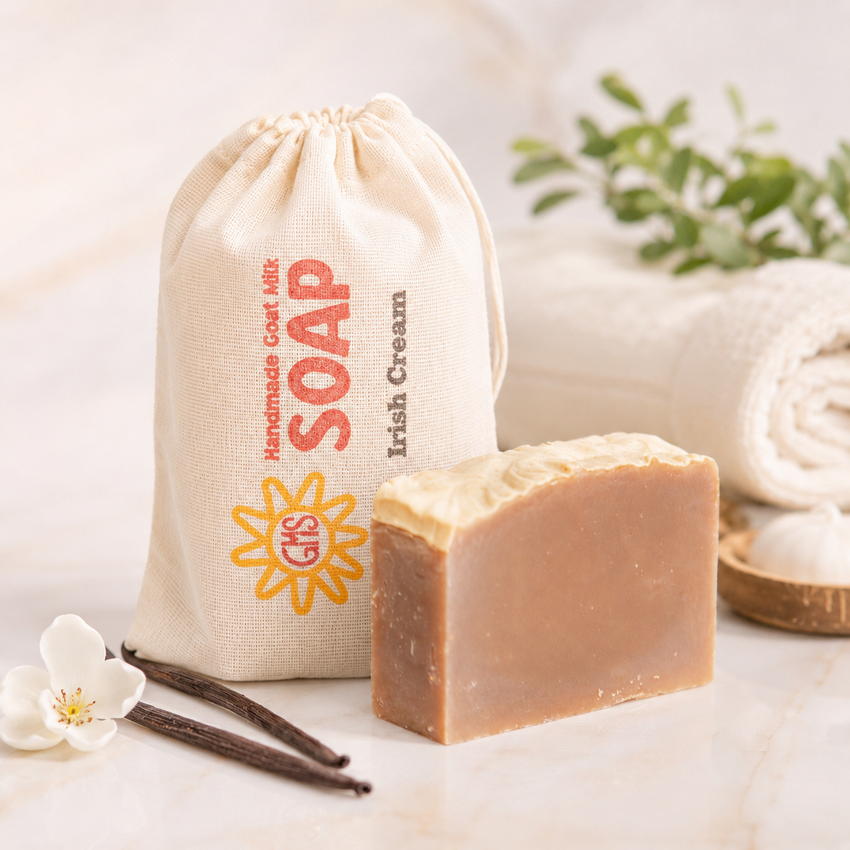 Bar of goat milk soap with a drawstring bag labeled 'Soap' on a light background