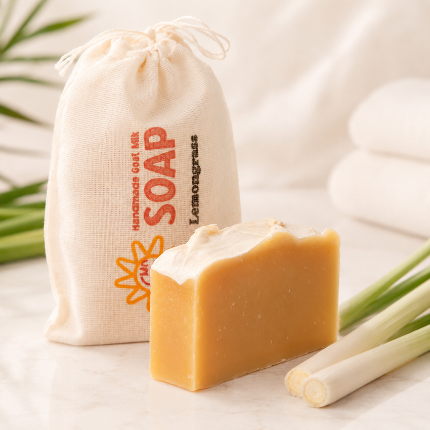 Bar of goat milk soap with a drawstring bag labeled 'Soap' on a light background
