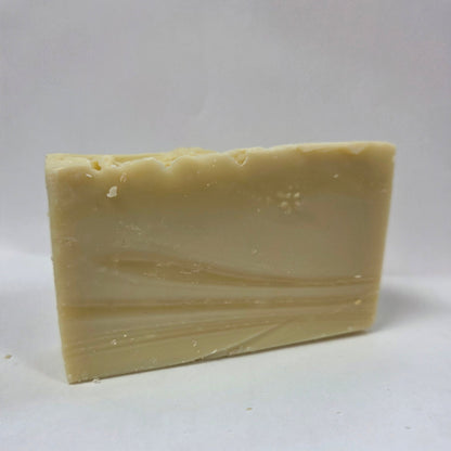 Bar of goat milk soap on a white background
