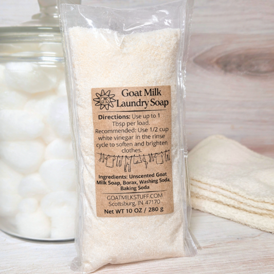 Goat milk laundry soap package with label on a wooden surface