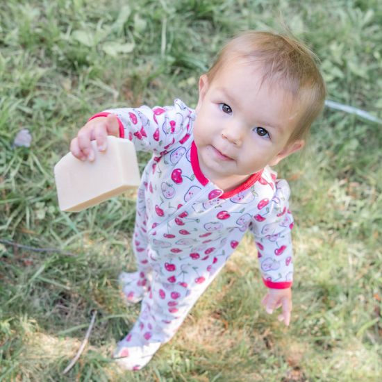 Kylie holding Purity Goat Milk Soap