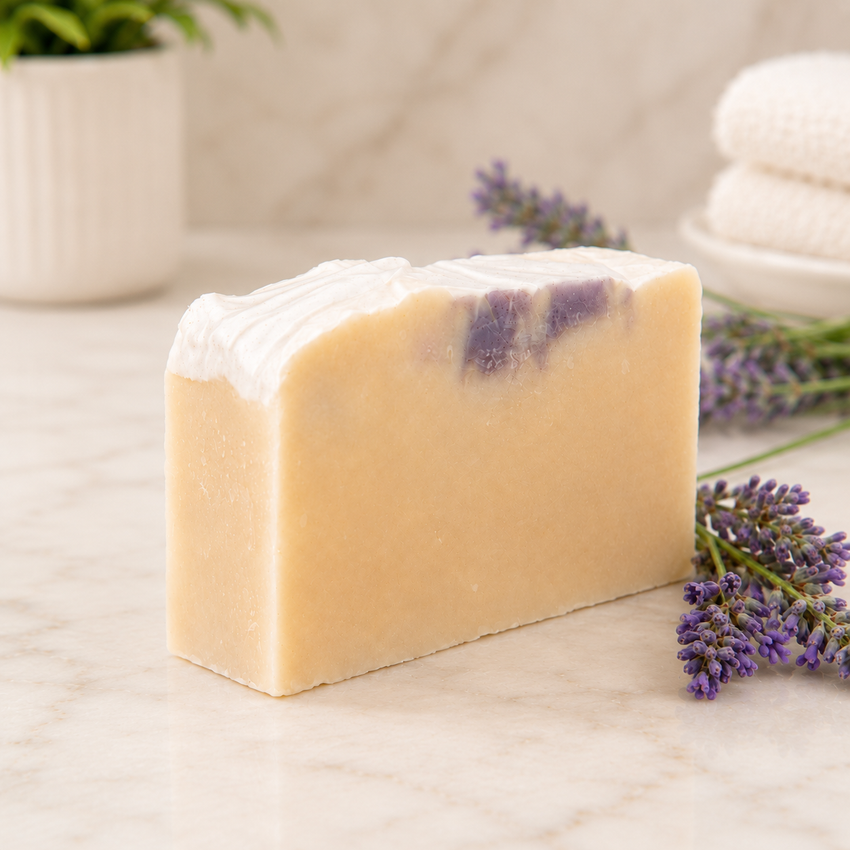 Bar of goat milk soap with lavender fragrance on a marble surface